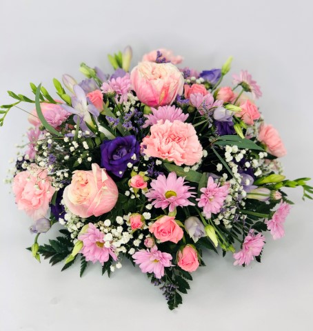 <h2>Lilac and Pink Classic Posy | Funeral Flowers</h2>
<ul>
<li>Approximate Size W 25cm H 40cm</li>
<li>Hand created lilac and pink posy in fresh flowers</li>
<li>To give you the best we may occasionally need to make substitutes</li>
<li>Funeral Flowers will be delivered at least 2 hours before the funeral</li>
<li>For delivery area coverage see below</li>
</ul>
<h2><br />Liverpool Flower Delivery</h2>
<p>We have a wide selection of Funeral Posies offered for Liverpool Flower Delivery. Funeral posies can be provided for you in Liverpool, Merseyside and we can organize Funeral flower deliveries for you nationwide. Funeral Flower can be delivered to the Funeral directors or a house address. They can not be delivered to the crematorium or the church.</p>
<br>
<h2>Flower Delivery Coverage</h2>
<p>Our shop delivers funeral flowers to the following Liverpool postcodes L1 L2 L3 L4 L5 L6 L7 L8 L11 L12 L13 L14 L15 L16 L17 L18 L19 L24 L25 L26 L27 L36 L70 If your order is for an area outside of these we can organise delivery for you through our network of florists. We will ask them to make as close as possible to the image but because of the difference in stock and sundry items, it may not be exact.</p>
<br>
<h2>Liverpool Funeral Flowers | Posies</h2>
<p>This beautiful posy has been loving handcrafted by our florist. A classic selection in lilac and pink including large-headed roses, freesias, lisianthus and spray chrysanthemums presented in a posy design.</p>
<br>
<p>Funeral posies are suitable as funeral flowers and as tribute gifts to the bereaved family. The Funeral posy is flowers arranged in a circular shape. In the case of cremation, the family may like individual posies which can also be used as table decorations at the wake.</p>
<br>
<p>Contents of the Extra Large Posy:40cm Posy Pad, 5 Pink Roses, 2 Pink Spray Roses, 2 Purple Lisianthus, 4 Lilac Freesia, 5 Pink Carnations, 3 Pink Spray Chrysanthemums, 3 Green Bupleurum and Lilac September Flower with mixed Foliage.</p>
<br>
<h2>Best Florist in Liverpool</h2>
<p>Trust Award-winning Liverpool Florist, Booker Flowers and Gifts, to deliver funeral flowers fitting for the occasion delivered in Liverpool, Merseyside and beyond. Our funeral flowers are handcrafted by our team of professional fully qualified who not only lovingly hand make our designs but hand-deliver them, ensuring all our customers are delighted with their flowers. Booker Flowers and Gifts your local Liverpool Flower shop.</p>
<p><br /><br /><br /></p>
<p><em>Vivian Hart - Review from Facebook - Funeral Flowers Liverpool</em></p>
<br>
<p><em>This 5 Star review was from Facebook - Booker Flowers and Gifts - Reviews Facebook</em></p>
<br>
<p><em>Visited Booker Flowers as my usual florist was closed. Ordered funeral flowers. The advice and customer service we were given was excellent. The flowers exceeded our expectations - will be using Booker Flowers in the future - Thank you</em></p>
<br>